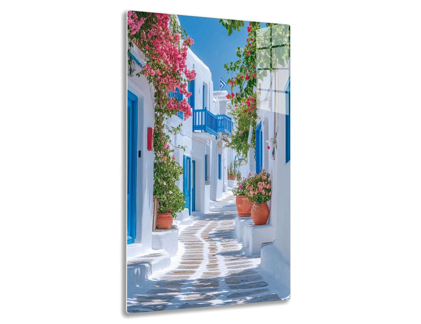 A picturesque alleyway in a Greek island town, with whitewashed buildings, blue doors and windows, and vibrant bougainvillea flowers adorning the walls and balconies along the cobblestone path.