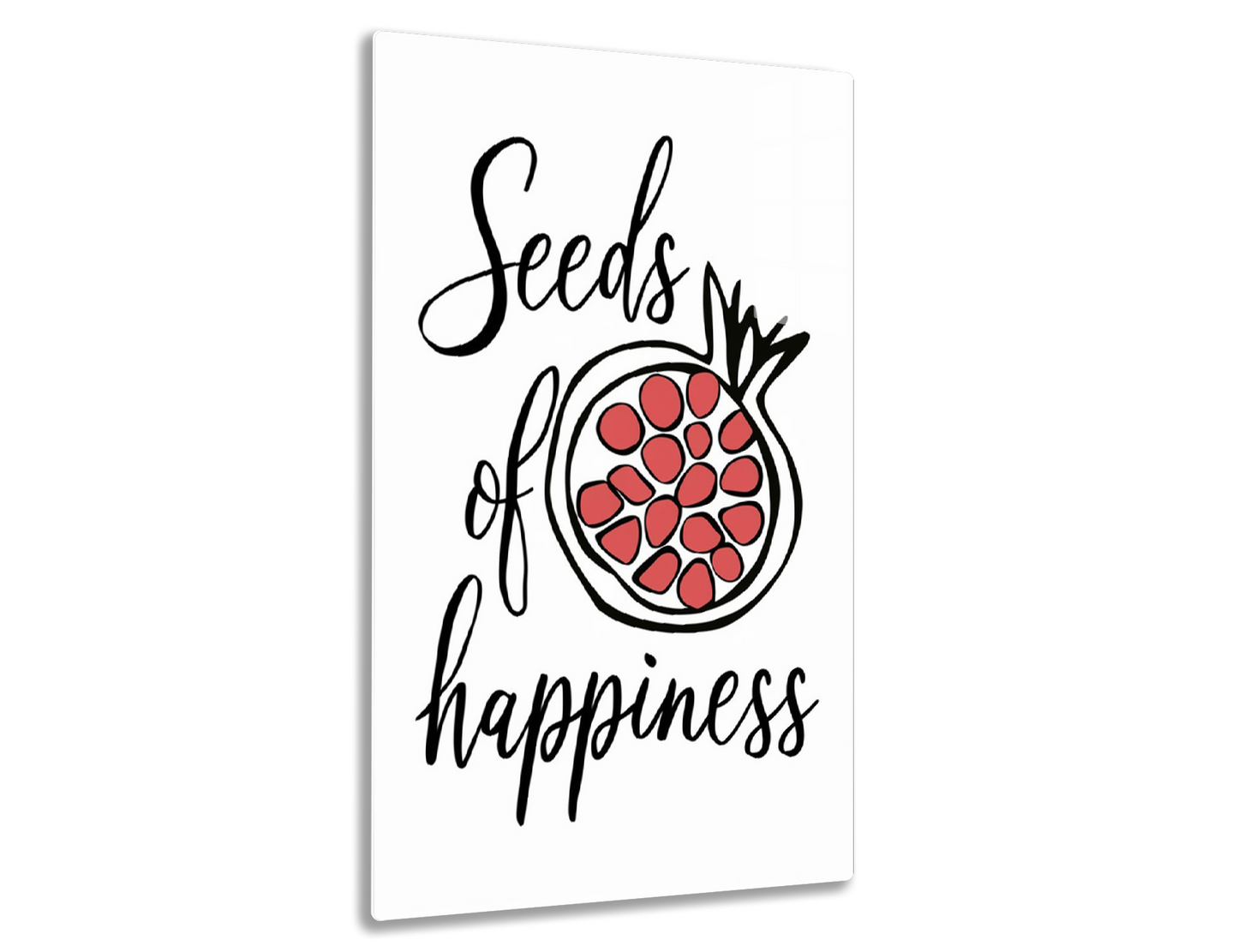 Black cursive text on a white background reads "Seeds of happiness" with an illustration of a pomegranate fruit showing its red seeds.
