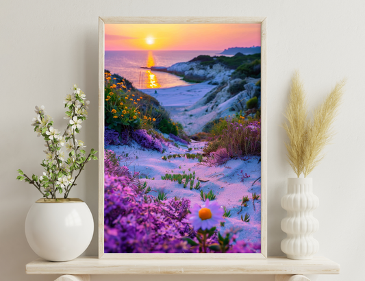 A stunning sunset over a sandy beach, with vibrant purple and yellow wildflowers in the foreground, creating a colorful contrast against the golden sun reflecting on the rippling waves.
