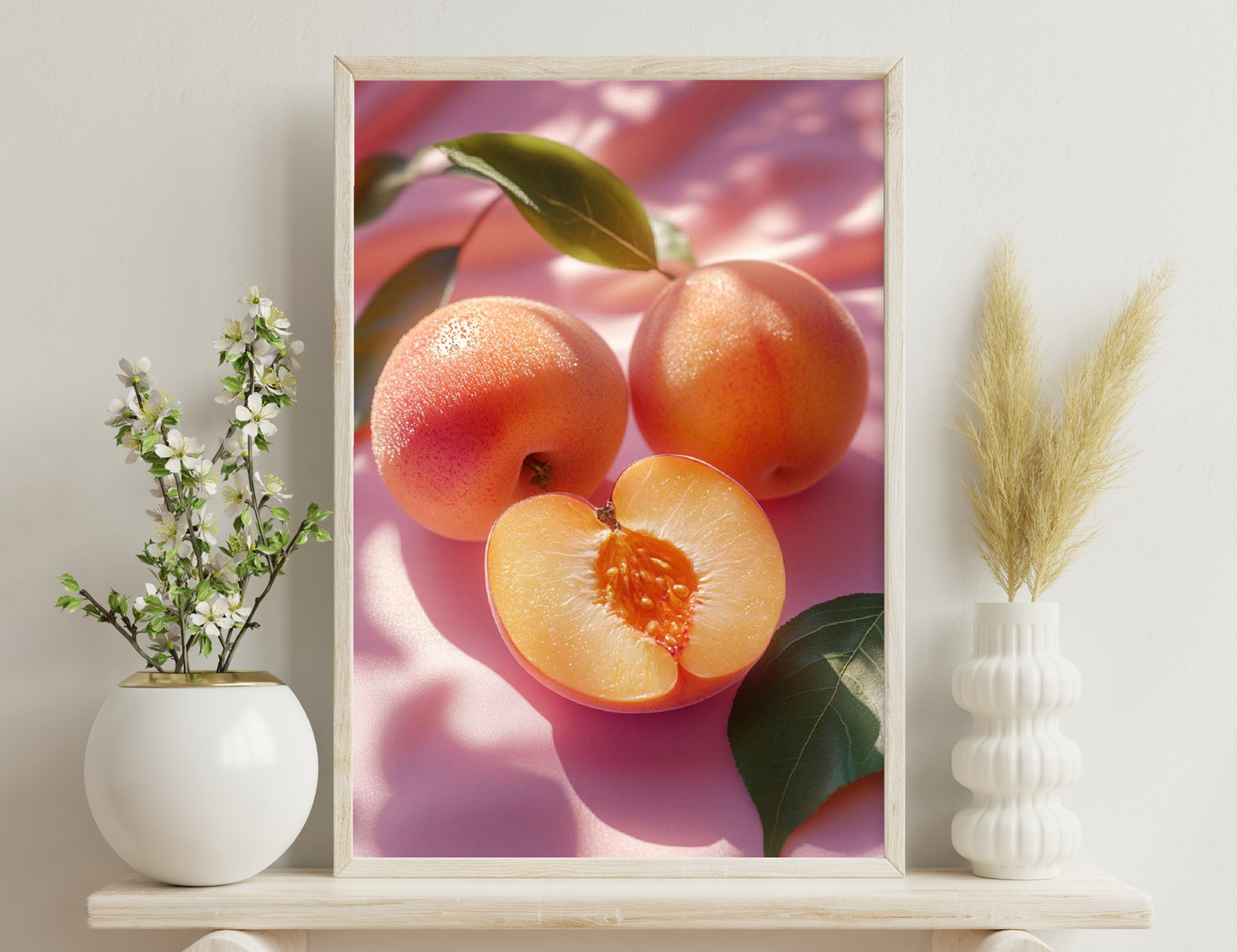 Ripe grapefruit halves with juicy flesh and segments, whole grapefruits with powdery pink skin, and green leaves on a vibrant pink background.
