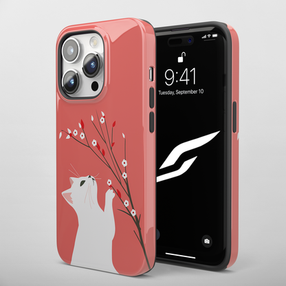 Floral Feline (iPhone MagSafe Case)Elevate your iPhone's protection and style with RimaGallery's Playful cat interacting with delicate flowers on a coral on iphone MagSafe Case against a dark backdropRimaGallery