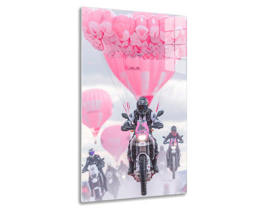 Motorcycle riders on the road with pink balloons trailing behind, creating a surreal and artistic visual effect.
