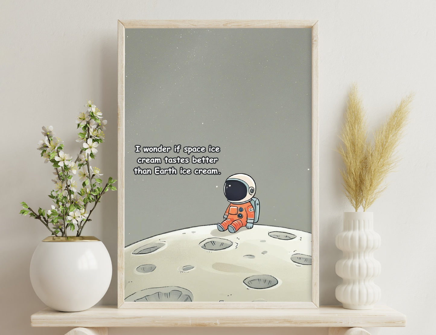 An astronaut sitting on the moon's surface wonders if space ice cream tastes better than Earth ice cream, against a starry background filled with craters.
