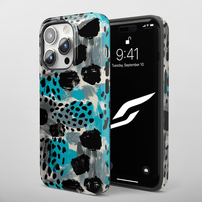 Teal Spots (iPhone MagSafe Case)Elevate your iPhone's protection and style with RimaGallery's Trendy animal print pattern with teal accents on iphone MagSafe Case against a dark backdrop. Enjoy duaRimaGallery