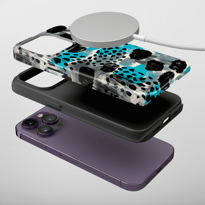 Teal Spots (iPhone MagSafe Case)Elevate your iPhone's protection and style with RimaGallery's Trendy animal print pattern with teal accents on iphone MagSafe Case against a dark backdrop. Enjoy duaRimaGallery
