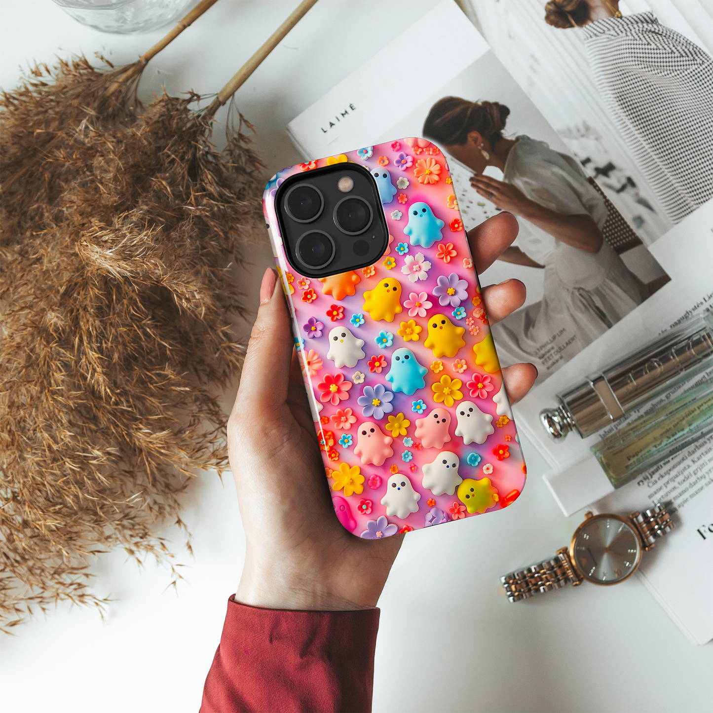 Ghoulish Garden (iPhone MagSafe Case)Elevate your iPhone's protection and style with RimaGallery's Playful ghost characters amidst a floral backdrop on a bright MagSafe Case against a dark backdrop. EnjRimaGallery
