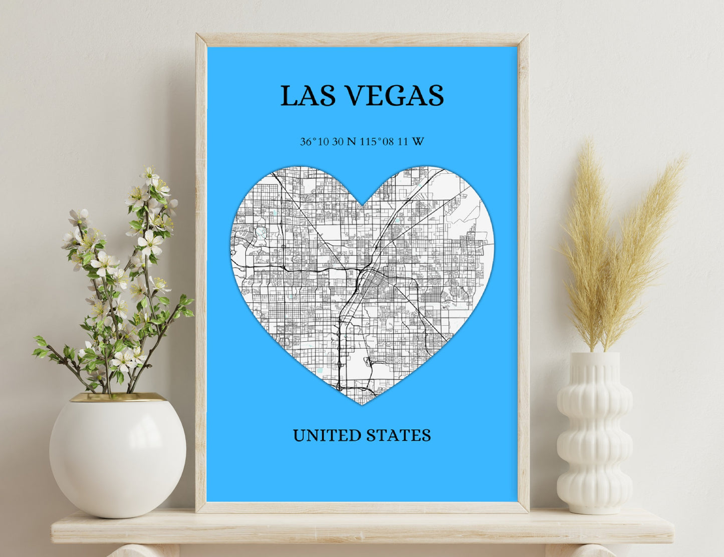 Map of Las Vegas streets in shape of heart on blue background, with city name, coordinates, and country text.
