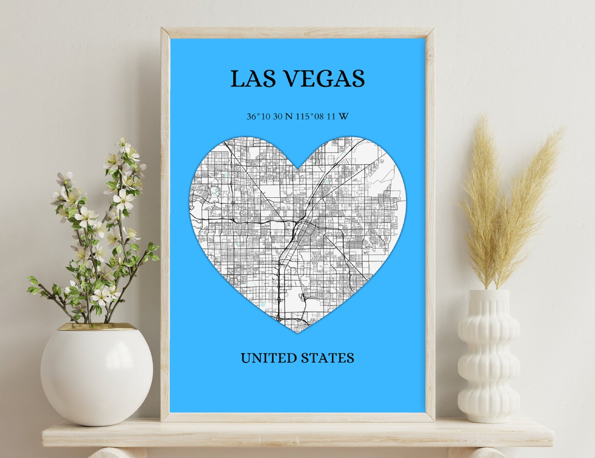 Map of Las Vegas streets in shape of heart on blue background, with city name, coordinates, and country text.
