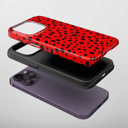 Dotted Delight - Red (iPhone Case 11-15)Elevate your iPhone's style with Rima's Red backdrop with varied black dots case. Sleek, durable protection for models 11-15. Free US shipping.RimaGallery
