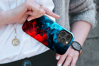 Whimsy Waves (iPhone Case 11-15)Elevate your iPhone's style with a Swirling red and blue design on a tough case. Sleek, durable protection for models 11-15. Free US shipping.RimaGallery