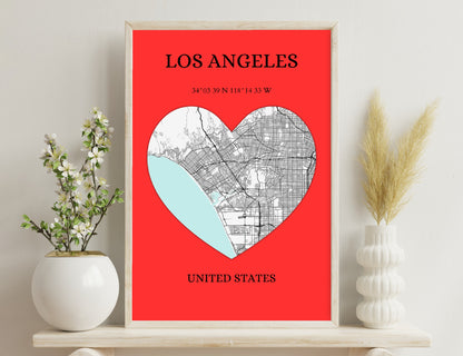 Los Angeles city map in the shape of a heart, with coordinates showing the location, against a red background.

