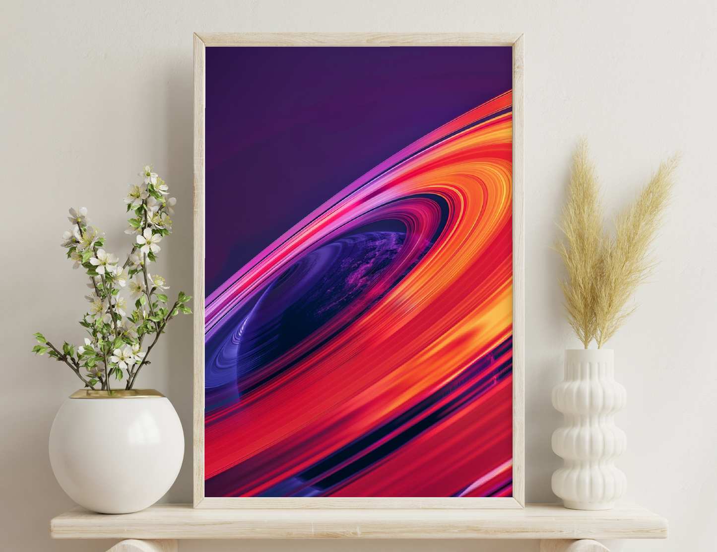 A striking close-up image of Saturn's rings showcasing vivid colors of orange, red, and purple, with a glimpse of the planet's surface in deep purple and blue hues.
