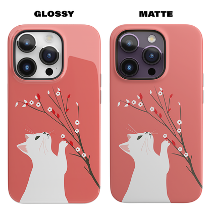 Floral Feline (iPhone MagSafe Case)Elevate your iPhone's protection and style with RimaGallery's Playful cat interacting with delicate flowers on a coral on iphone MagSafe Case against a dark backdropRimaGallery