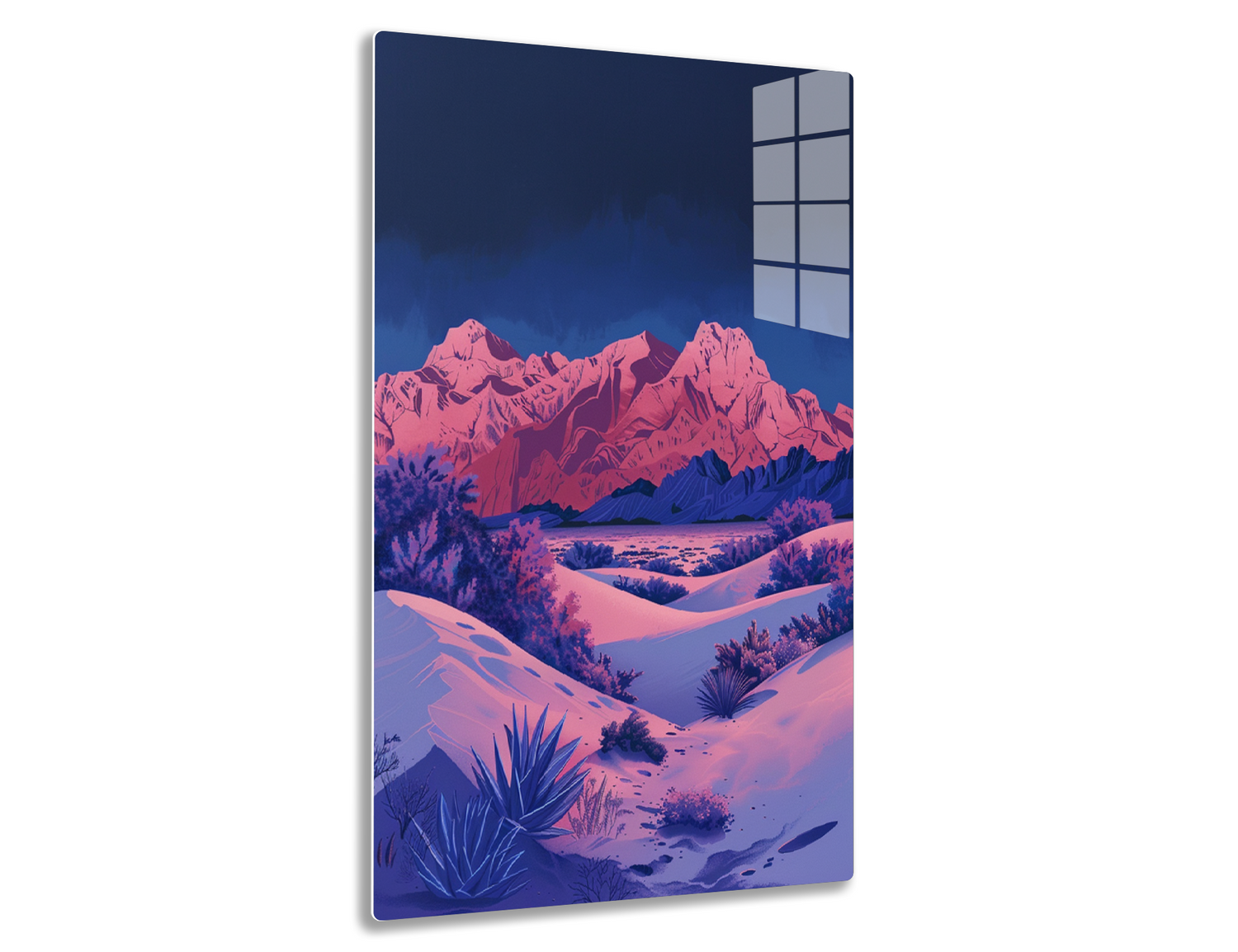 Scenic view of snow-covered desert landscape with vibrant pink mountains against deep blue sky, featuring sagebrush and yucca plants in foreground.
