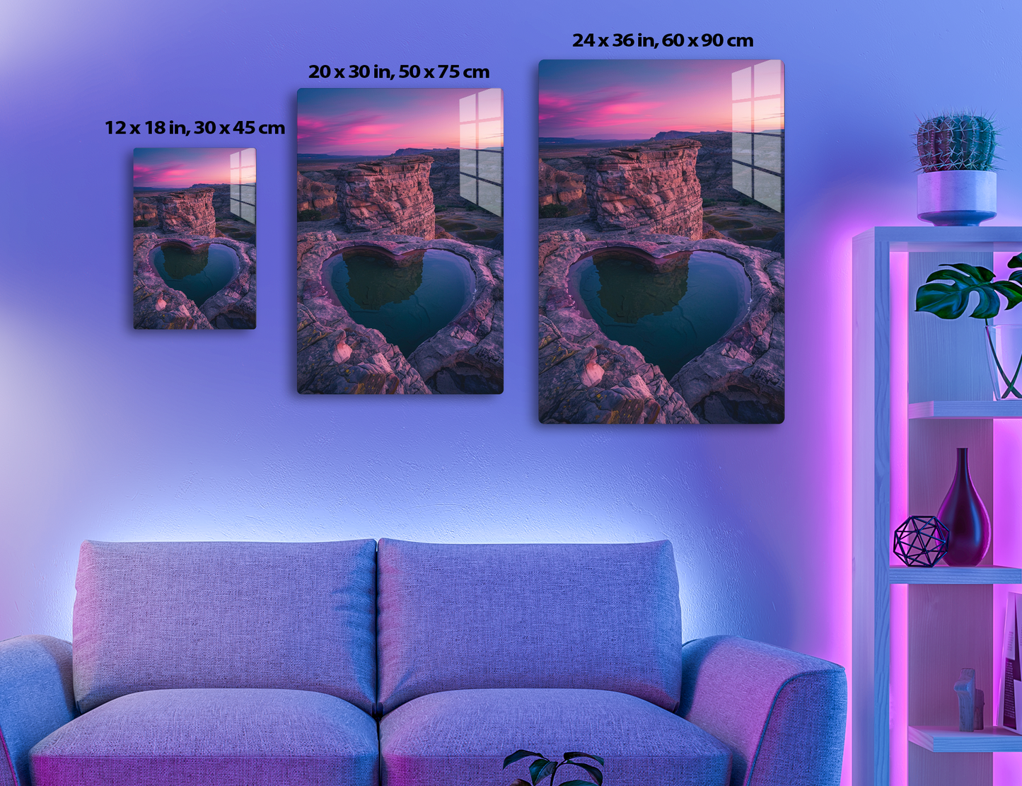 Heart-shaped pool at the edge of a canyon cliff reflecting the vibrant pinkish-purple sunset sky, surrounded by rugged red rock formations.

