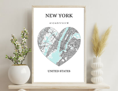 Heart-shaped map of New York City, with streets in black lines over a blue water layout, displaying geographic coordinates of 40°42'46"N 74°00'21"W, title reads "NEW YORK UNITED
