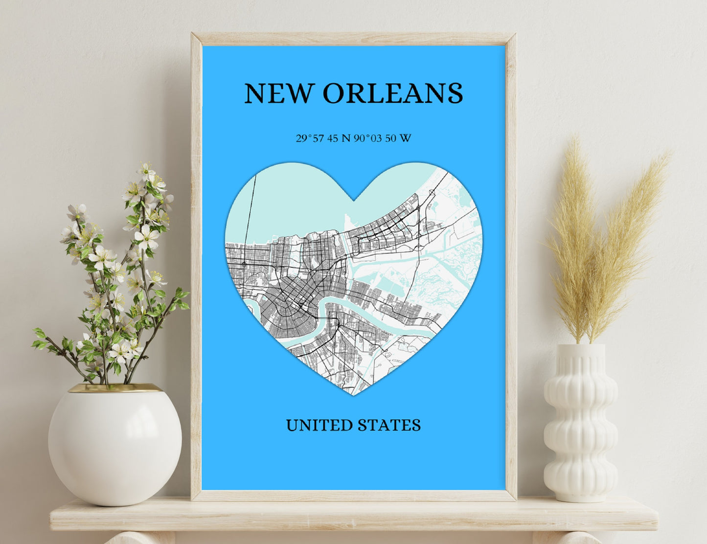 Map of New Orleans in the shape of a heart, showing the city's streets and coordinates, on a blue background with text "New Orleans, United States".

