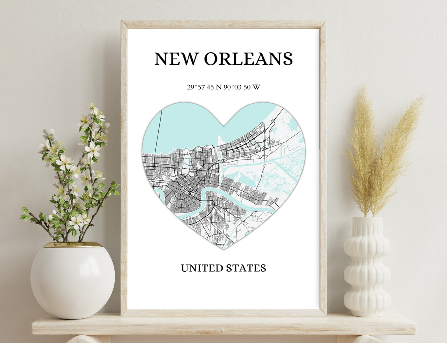 New Orleans city map in the shape of a heart, with streets and water bodies shown in black and mint green colors, geographic coordinates given below.
