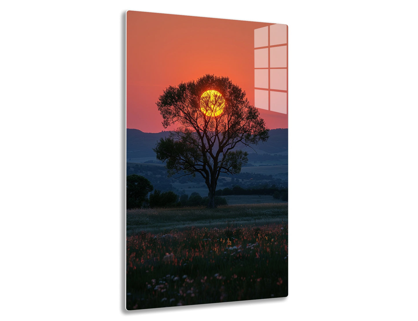 Majestic tree silhouetted against a fiery orange sunset, its branches framing the brilliant sun in a picturesque landscape with rolling hills and wildflowers in the foreground.
