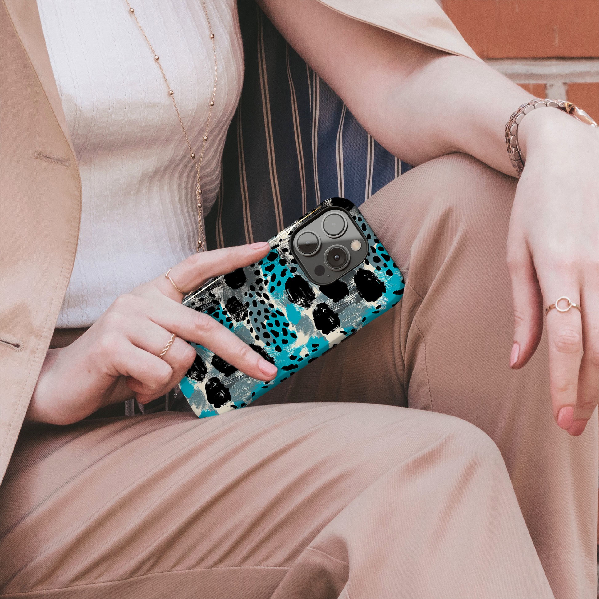 Teal Spots (iPhone MagSafe Case)Elevate your iPhone's protection and style with RimaGallery's Trendy animal print pattern with teal accents on iphone MagSafe Case against a dark backdrop. Enjoy duaRimaGallery