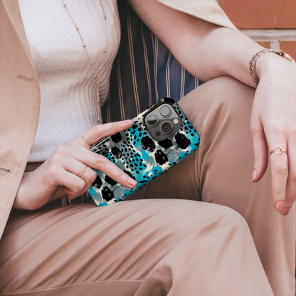 Teal Spots (iPhone MagSafe Case)Elevate your iPhone's protection and style with RimaGallery's Trendy animal print pattern with teal accents on iphone MagSafe Case against a dark backdrop. Enjoy duaRimaGallery