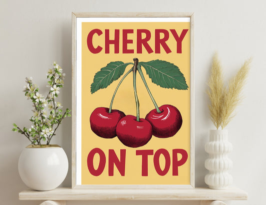Cherry advertisement poster featuring three ripe red cherries with green leaves on a beige background, with the text "CHERRY ON TOP" in bold red and black lettering.
