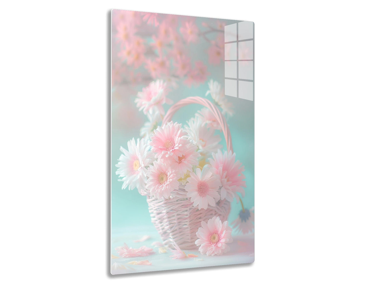 A woven basket filled with delicate pink and white chrysanthemums against a soft pastel pink and blue backdrop, creating a dreamy, feminine floral arrangement.
