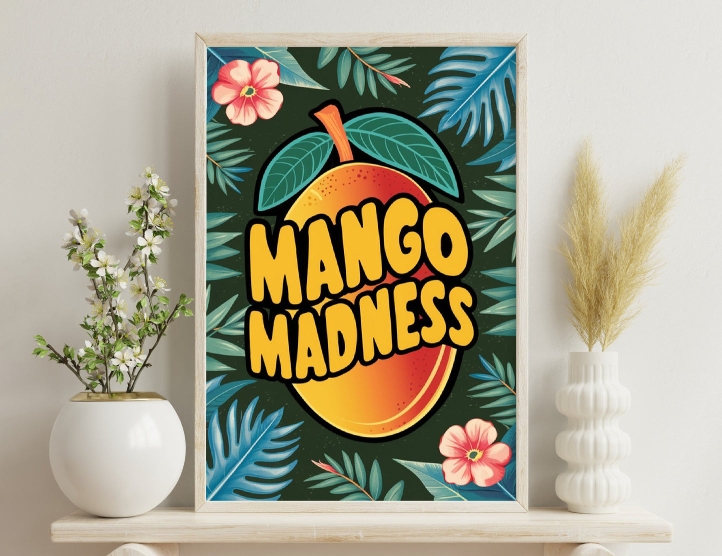 Mango graphic with "Mango Madness" text on a dark background with tropical flowers and green leaves, evoking a vibrant and fruity summer vibe.
