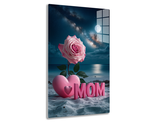 A pink rose and pink heart with "MOM" text against a scenic night sky with a full moon and Milky Way over a peaceful ocean, for a Mother's Day theme.
