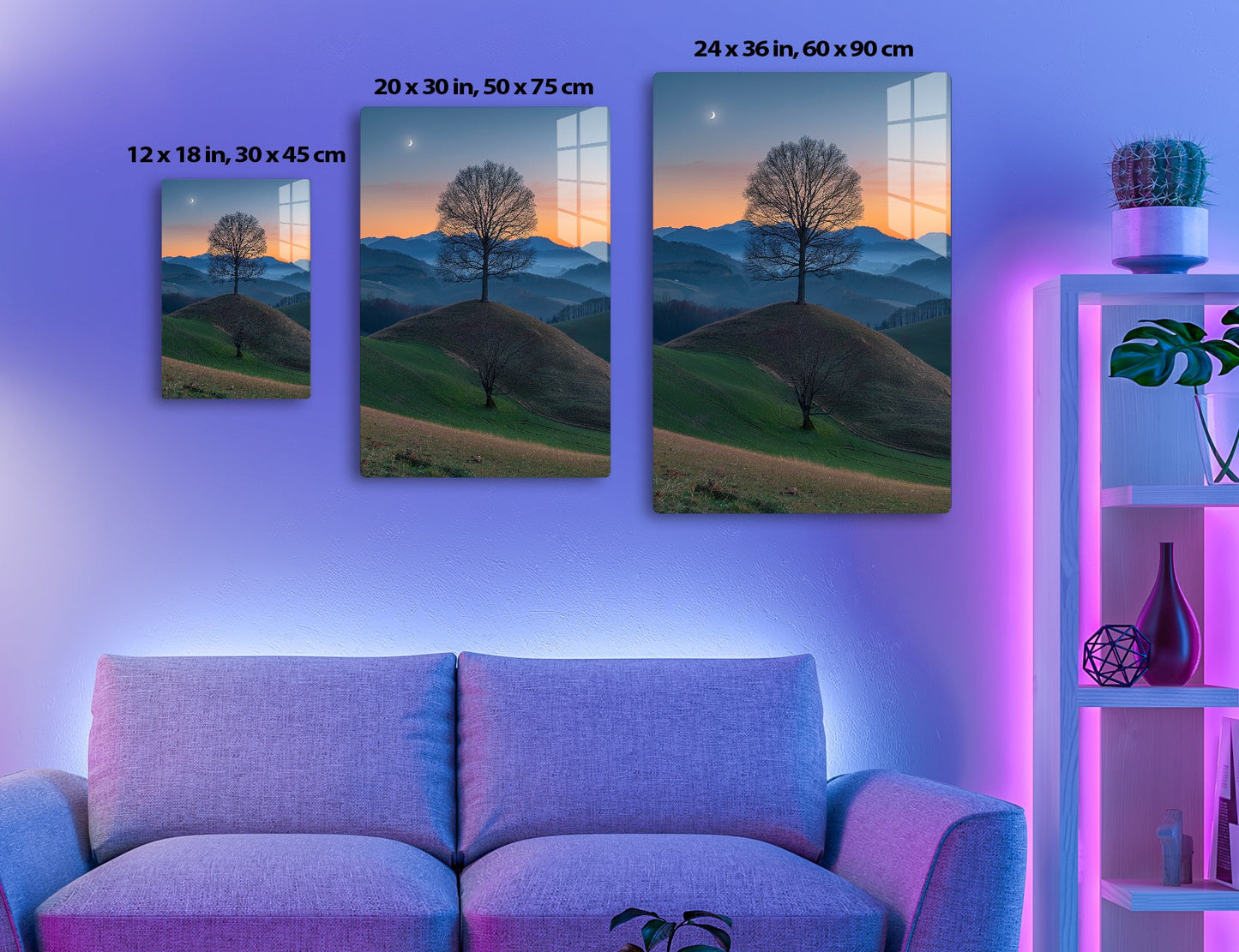 A lone bare tree stands on a hill at sunset, with a crescent moon in the sky and rolling mountains in the distance creating a serene, picturesque landscape.
