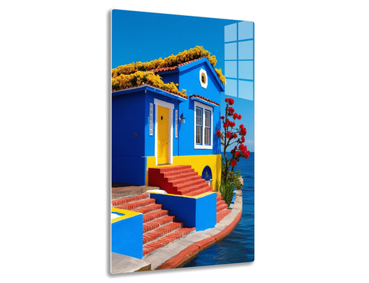 A vibrant blue and yellow house with red tiled roof, overlooking the ocean and adorned with red flowering plants, creating a colorful and picturesque scene.

