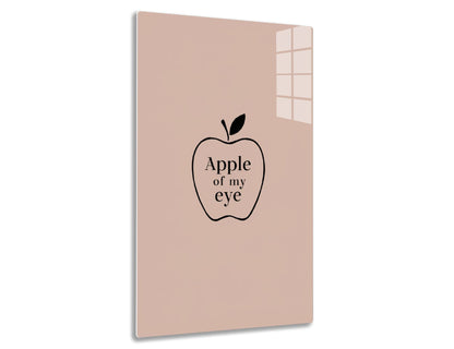 Apple illustration with text "Apple of my eye" on a light pink background
