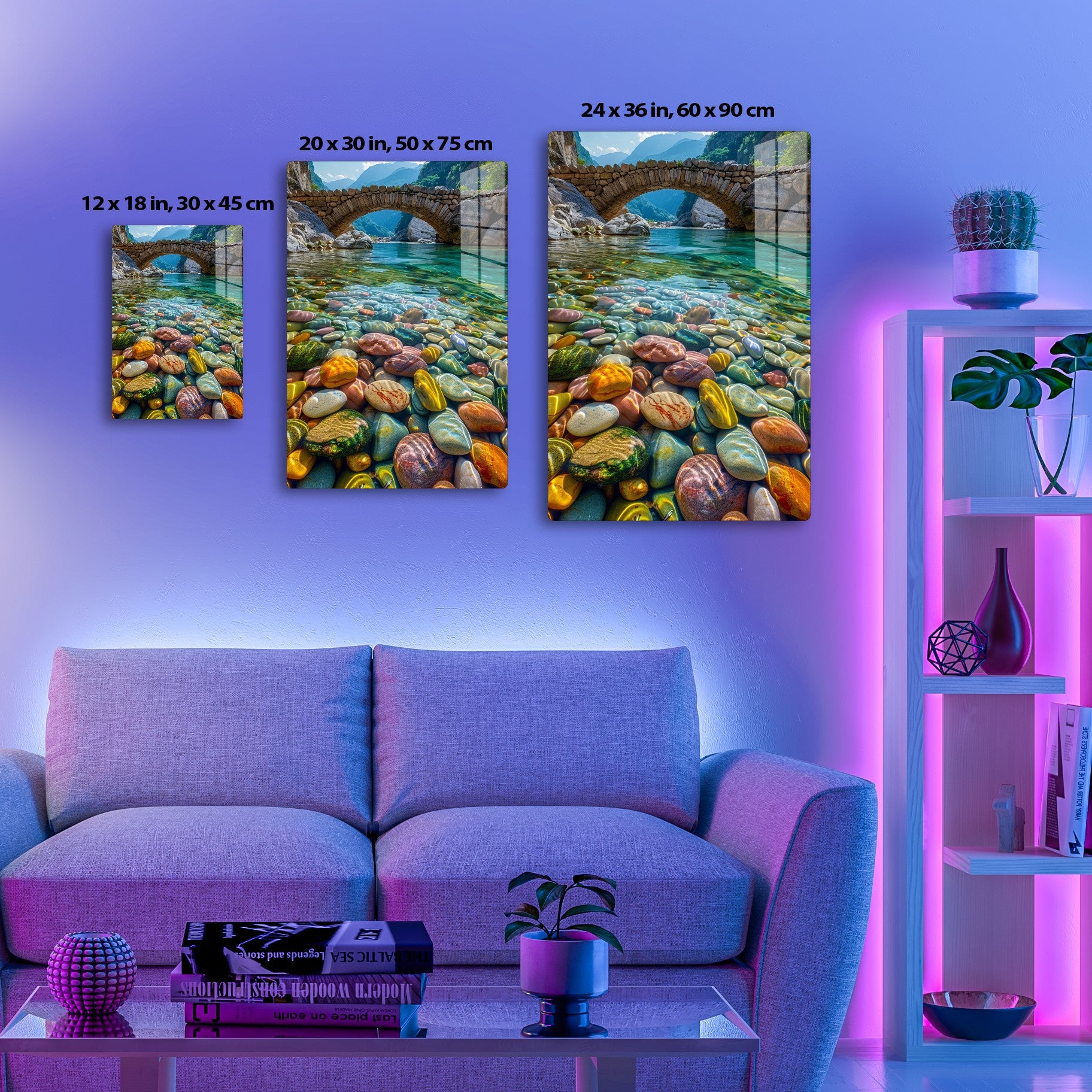 A beautiful stone bridge arches over a crystal-clear river running through a mountainous gorge, with the riverbed covered in smooth, colorful pebbles that create a mesmerizing pattern of vibrant colors and natural textures.
