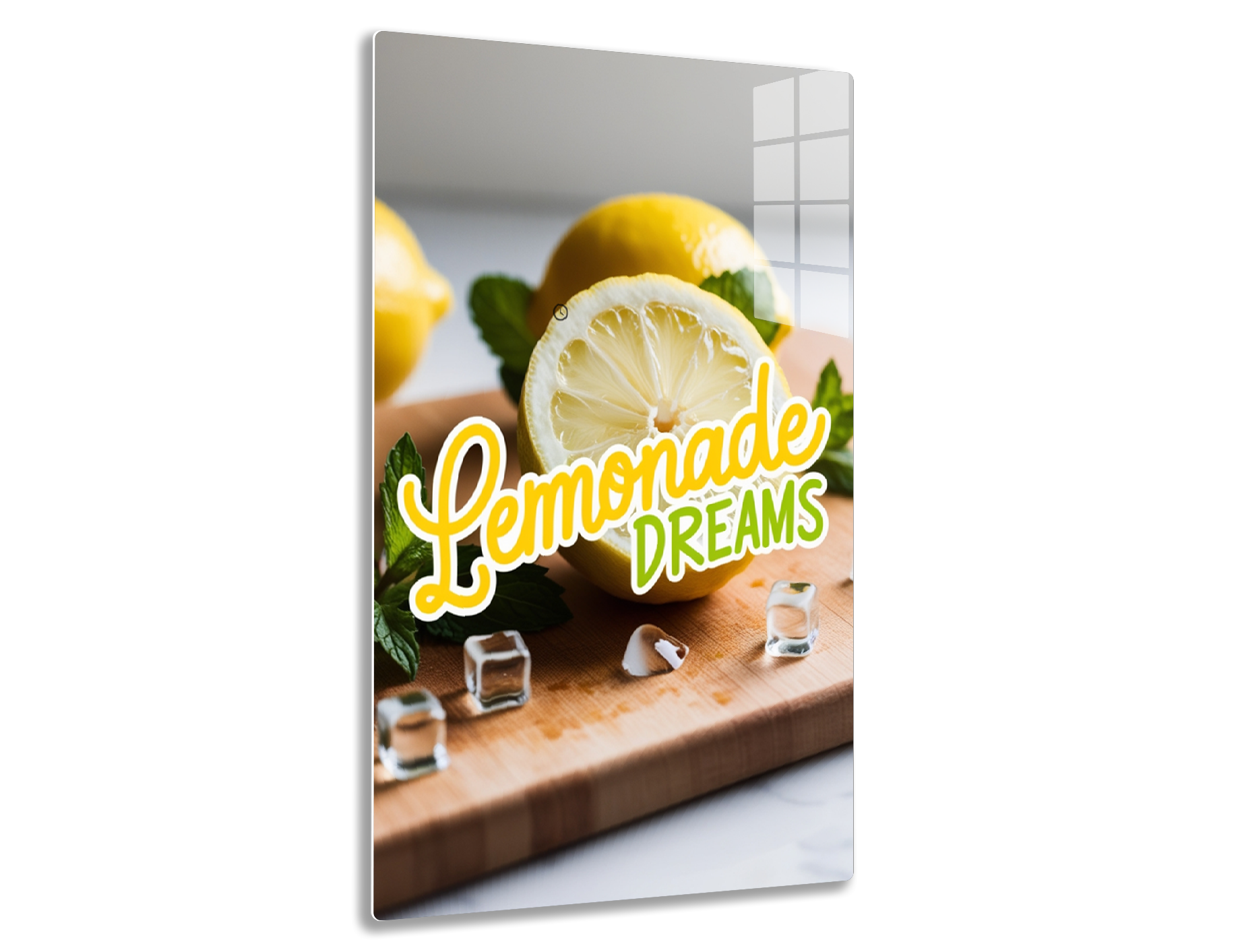 A closeup image of fresh lemons, one cut in half revealing its juicy interior, arranged with mint leaves and the text "Lemonade Dreams" on a wooden cutting board.
