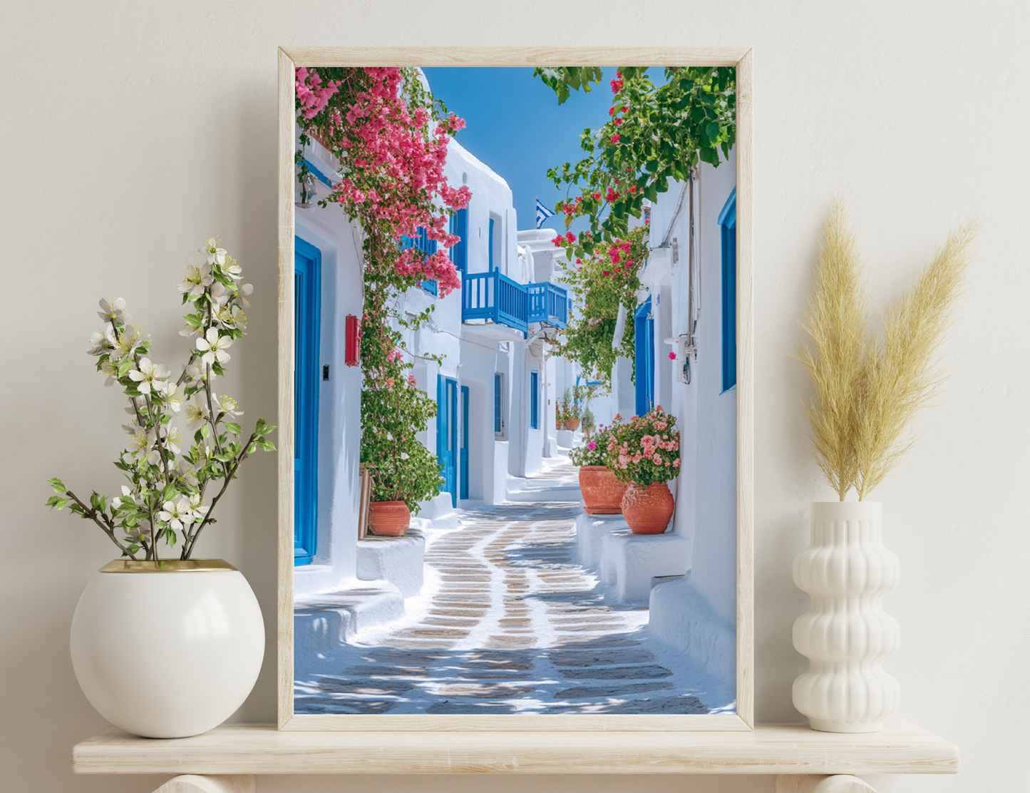 A picturesque alleyway in a Greek island town, with whitewashed buildings, blue doors and windows, and vibrant bougainvillea flowers adorning the walls and balconies along the cobblestone path.
