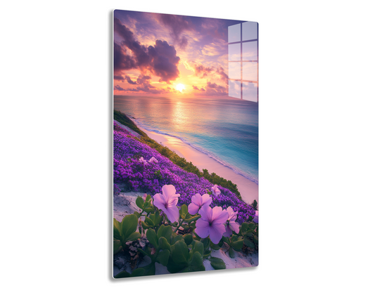 A stunning sunset over the ocean, with vibrant purple and orange clouds reflecting on the calm water. In the foreground, a field of blooming purple flowers adorns the sandy beach, creating a serene and picturesque coastal scene.

