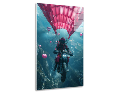 A daring motorcyclist rides a bike amidst vibrant pink hot air balloons in the sky, creating a surreal and adventurous scene against a backdrop of rugged terrain below.
