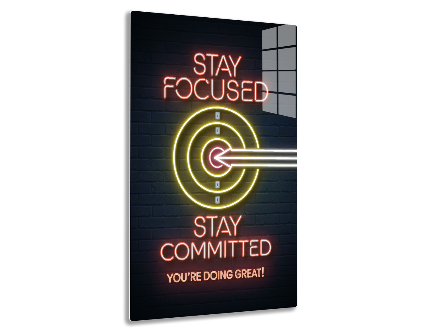 Neon sign with "Stay Focused" and target icon, along with "Stay Committed, You're Doing Great!" in motivational text and colors.
