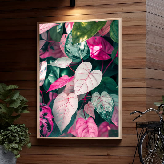 Vibrant pink and green tropical leaves with detailed veining and textures, creating an abstract and lush floral composition.
