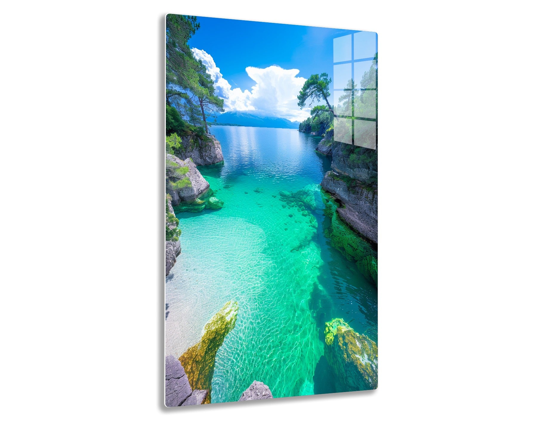 Stunning lake with crystal clear turquoise and emerald green waters, surrounded by rocky shores with pine trees, under a blue sky with fluffy white clouds reflecting on the serene water surface.
