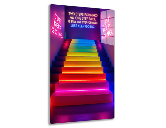 Neon-lit stairs in rainbow colors with motivational text "Two steps forward and one step back is still one step forward. Just keep going."
