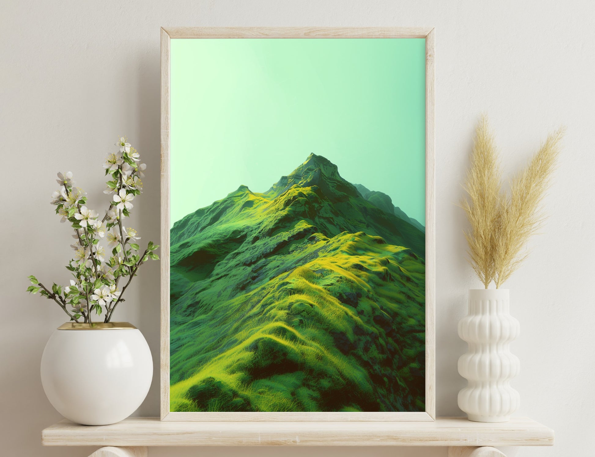 An abstract mountainous landscape with vibrant green and yellow textures across undulating slopes against a soft green sky.
