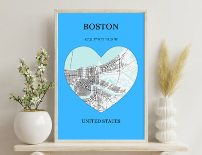 Map of Boston in a heart shape with street layout on a blue background, showing coordinates 42°21'37"N 71°03'28"W and location United States.

