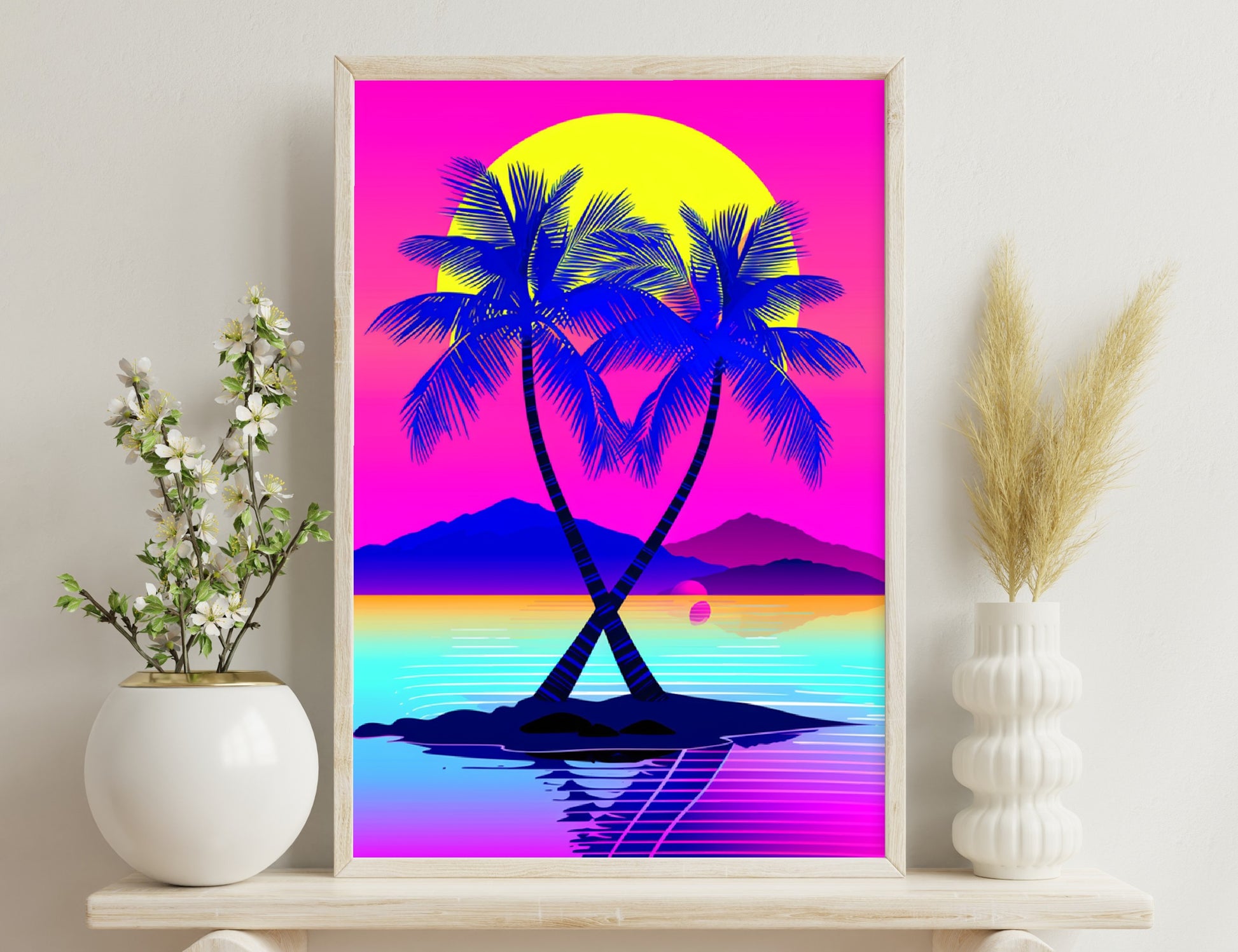 A colorful illustration of two palm trees forming a heart shape silhouetted against a bright yellow sun, set on a small island surrounded by vibrant blue water reflecting the pink and purple mountains in the background.
