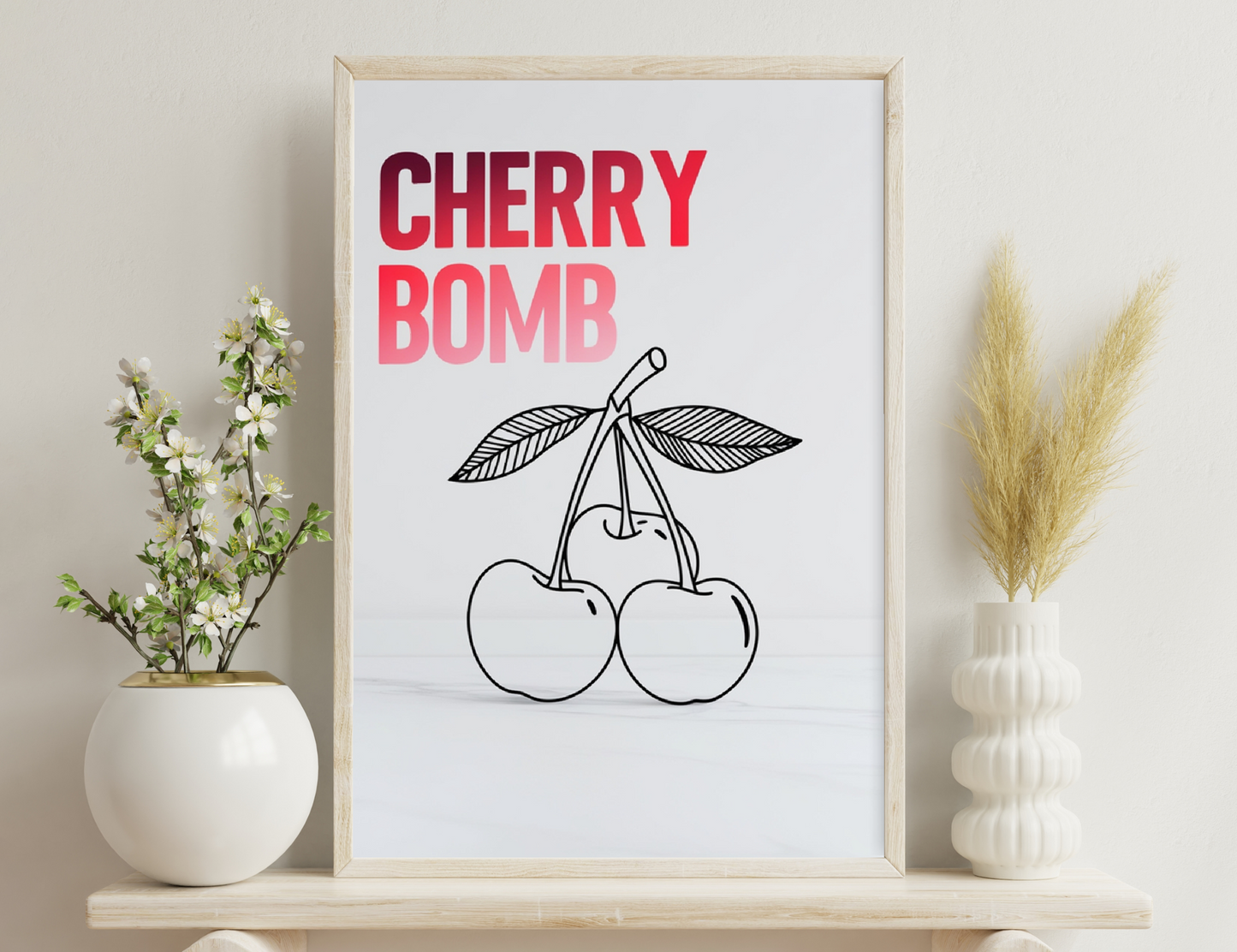 Cherry bomb graphic featuring the words "CHERRY BOMB" in bold red text above an illustration of two cherries with stems and leaves in black outline on a white background.
